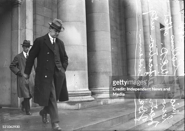 Michael Collins leaving Earlsfort Terrace after a Dáil Treaty debate, Circa 1921. In the background is his ADC Col. Joe O'Reilly. .