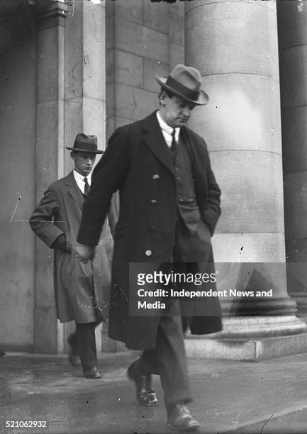 Michael Collins leaving Earlsfort Terrace after a Dáil Treaty debate, Circa 1921. In the background is his ADC Col. Joe O'Reilly. .
