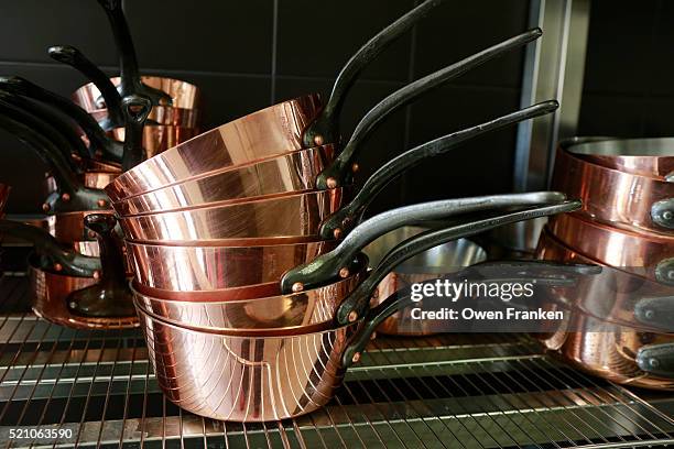 copper pots in the kitchen of restaurant guy savoy, paris - kitchen utensil stock pictures, royalty-free photos & images