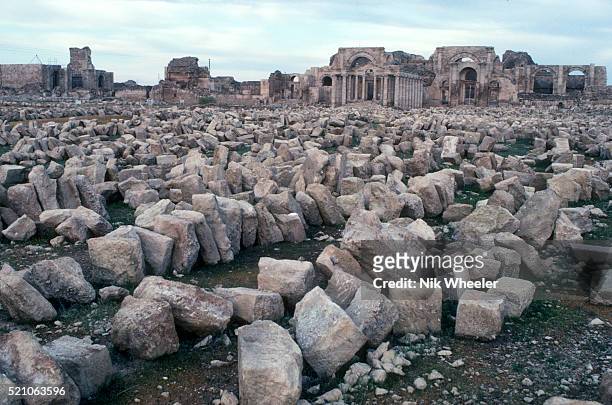 Loose stones scattered on the ground litter the ancient Parthian ruins of Hatra, a UNESCO World Heritage site recently destroyed by ISIS militants,...