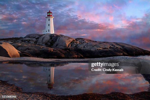 tide pool by lighthouse - peggys cove stock-fotos und bilder