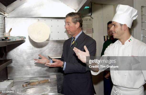 Prince Charles Is Learning To Toss Pizza Dough During His Visit To The Benvenuti Italian Restaurant In Alnwick, Northumberland. Restaurant Owner...