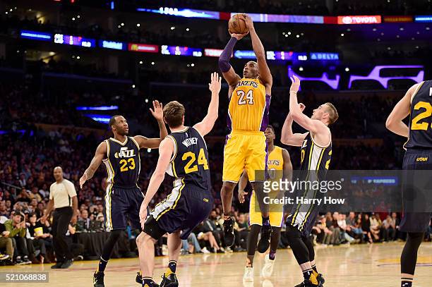 Kobe Bryant of the Los Angeles Lakers goes up for a shot against Jeff Withey of the Utah Jazz in the fourth quarter at Staples Center on April 13,...