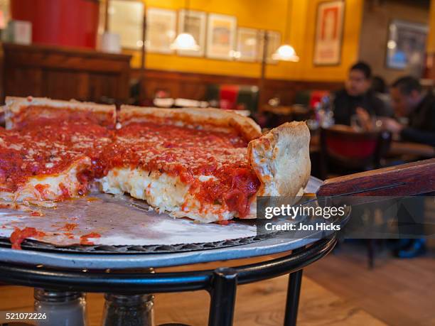 a chicago-style deep-dish pizza. - deep dish pizza foto e immagini stock