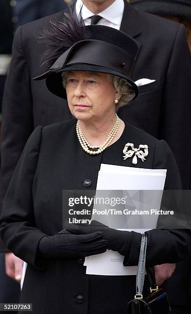 The Royal Family Gather At Westminster Abbey For The Funeral Of The Queen Mother Who Had Lived To The Age Of 101. A Portrait Of Queen Elizabeth Ll...