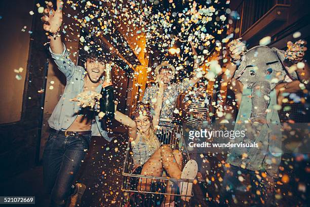 partying teenagers being silly in street - animal themes stock pictures, royalty-free photos & images
