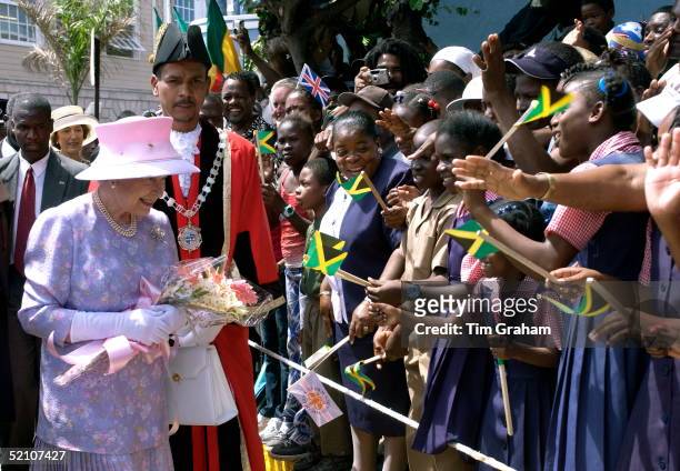 Queen Elizabeth Ll With The Mayor Of Montego Bay Smiling As She Meets An Enthusiastic Crowd That Has Gathered To Greet Her In Sam Sharpe Square Where...