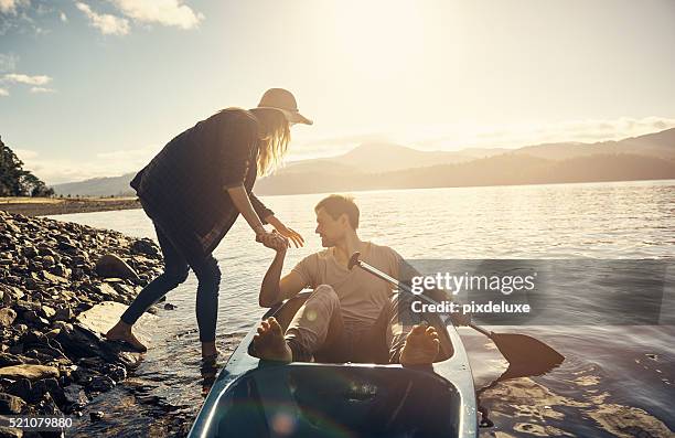 watch your step - two people canoeing on a lake stock pictures, royalty-free photos & images