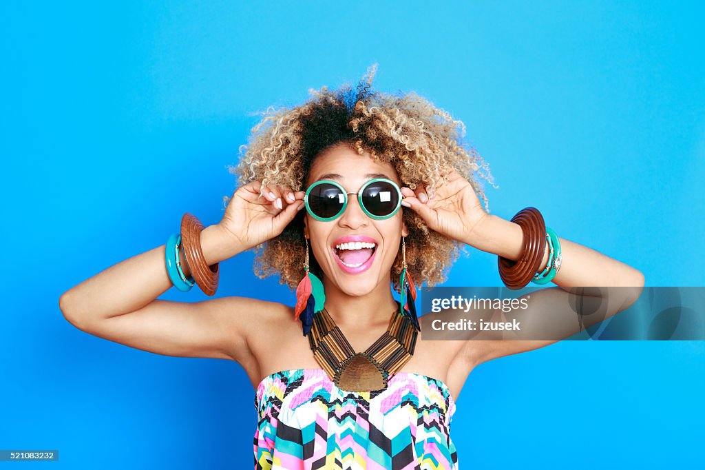 Summer portrait of excited afro american young woman