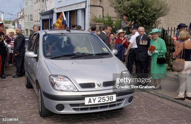 The Queen In The Channel Islands Smiling As A Renault Scenic Car Arrives Bearing Her Official Standard Flag To Take Her Around The Narrow Lanes Of...