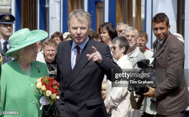 The Queen With Sir Robin Janvrin, Her Private Secretary During Her Visit To The Island Alderney, The Channel Islands.