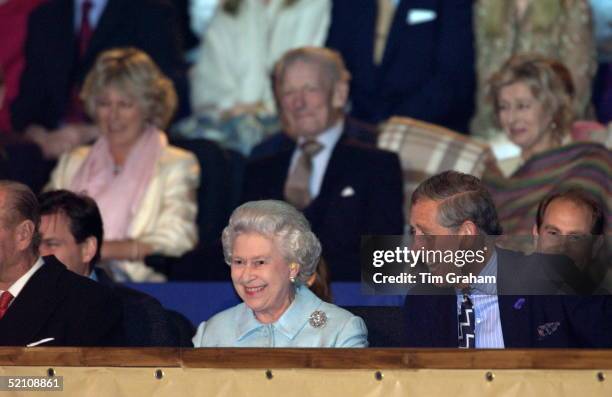 Queen Elizabeth II Wearing Ear Plugs Laughing With Her Son Prince Charles At "party At The Palace", A Unique Pop Concert Held In The Grounds Of...