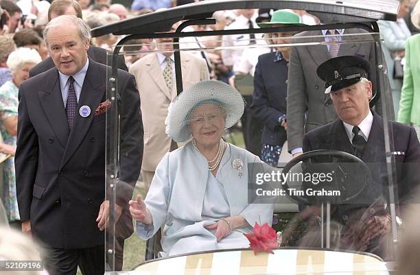 The Queen Mother Touring The Sandringham Flower Show In Her Golf Buggy Driven By Her Chauffeur In Norfolk.