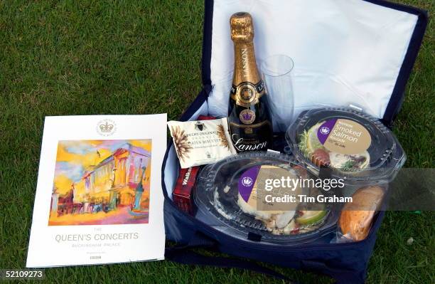 Each Guest Attending The 'prom At The Palace' Classical Concert At Buckingham Palace Receives, Courtesy Of The Queen, A Golden Jubilee Cool Bag Which...