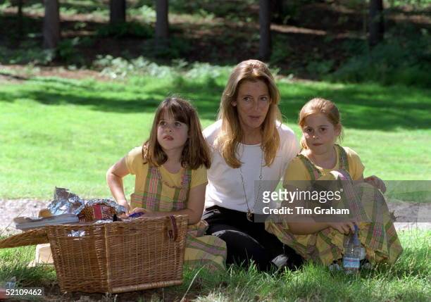 Princess Beatrice And Princess Eugenie With Their Grandmother, Susan Barrantes, Enjoying A Picnic At Wentworth Golf Course During A Charity Golf...