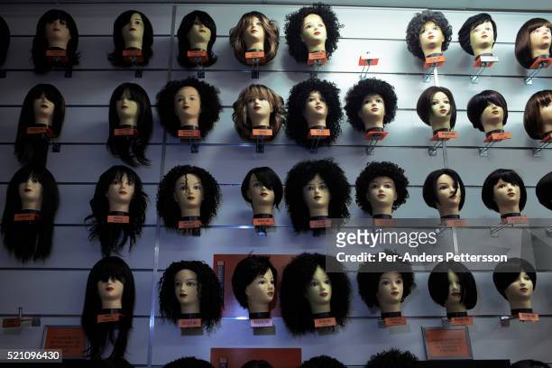 Hair pieces are on display in a shop on October 5, 2012 at Maponya shopping Mall, Soweto, South Africa. Maponya is one of several new shopping malls...
