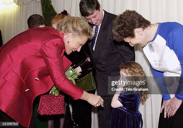 Princess Michael Of Kent Receiving Flowers From A Little Girl During A Visit To An Antiques Fair In London In Aid Of The Children's Charity ' Kids '