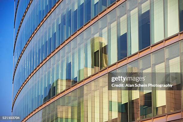 reflection of skyscrapers in windows - fensterfront stock-fotos und bilder