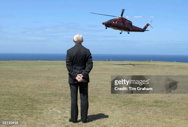 Watching As The Queen Is Leaving The Island Of Alderney In Her Royal Flight Helicopter During Her Visit To The Channel Islands