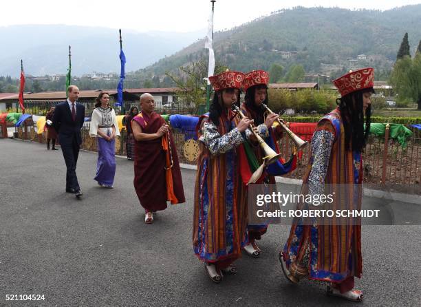 Britain's Prince William, Duke of Cambridge and his wife Catherine, Duchess of Cambridge follow a ceremonial procession after arriving at the...