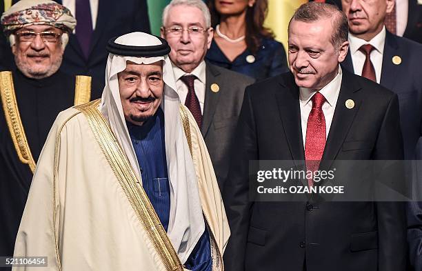 Turkish President Recep Tayyip Erdogan poses with King Salman bin Abdulaziz Al Saud of Saudi Arabia during the family photo of the 13th Organization...