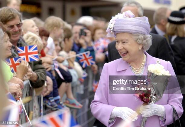The Queen Laughing And Talking To People In The Crowd During A Walkabout In Kettering, Northamptonshire.