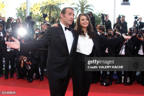 French actor Jean Dujardin and French actress Berenice Bejo pose on the red carpet before the screening of "The Artist" presented in competition at...