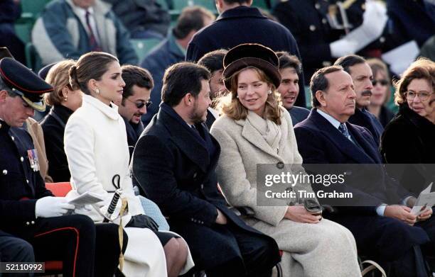 The Jordan Royal Family Attending The Sandhurst Military Passing Out Parade. Queen Rania, King Abdullah And Queen Noor Watching The Parade.