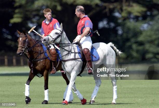 Polo At Cirencester In Gloucestershire - Prince Charles And Prince Harry Talking Together After The Match Which Their Team Won.