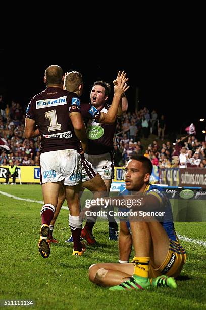 Jamie Lyon of the Sea Eagles celebrates with his team mates after scoring a try during the round seven NRL match between the Manly Sea Eagles and...