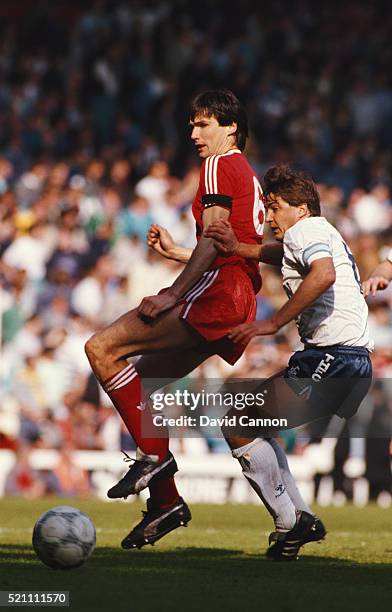 Liverpool captain Alan Hansen is challenged by Spurs captain Gary Mabbutt during a First Division match between Liverpool and Tottenham Hotspur at...