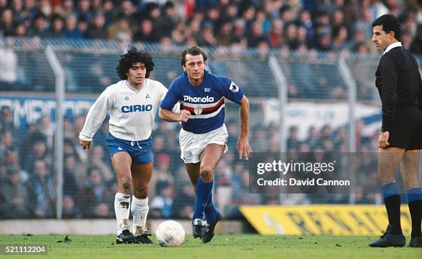 Sampdoria player Trevor Francis in action as Maradona looks on during a Serie A match between Sampdoria and Napoli circa 1984 in Genoa, Italy.