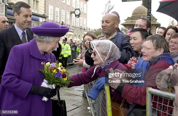 The Queen [ With Bodyguard Chief Inspector Richard Griffin Behind ] Talking To A Lady In The Crowd During Her Visit To Brighton, Sussex.