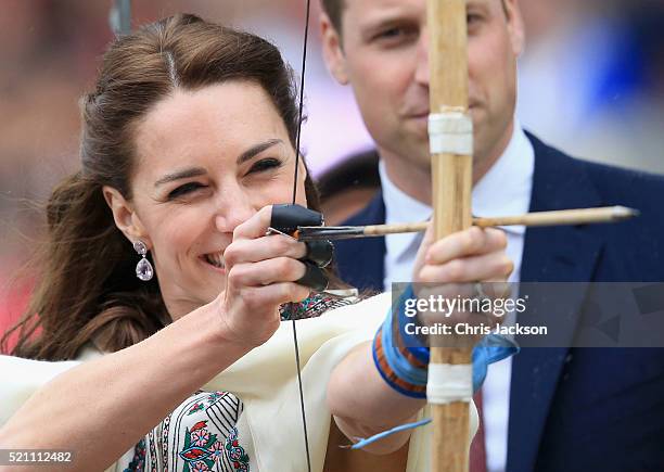 Prince William, Duke of Cambridge looks on as Catherine, Duchess of Cambridge fires an arrow during an Bhutanese archery demonstration on the first...