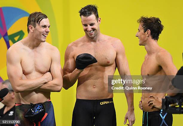 Kyle Chalmers, James Magnussen and Cameron McEvoy of Australia catch their breath after competing in the 4 x 100 metre Freestyle Relay during the...