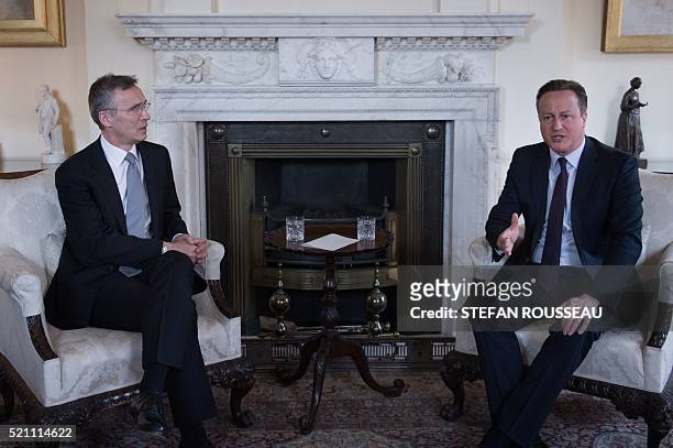 Britain's Prime Minister David Cameron talks at the start of a meeting with NATO Secretary General Jens Stoltenberg at 10 Downing Street in London on...