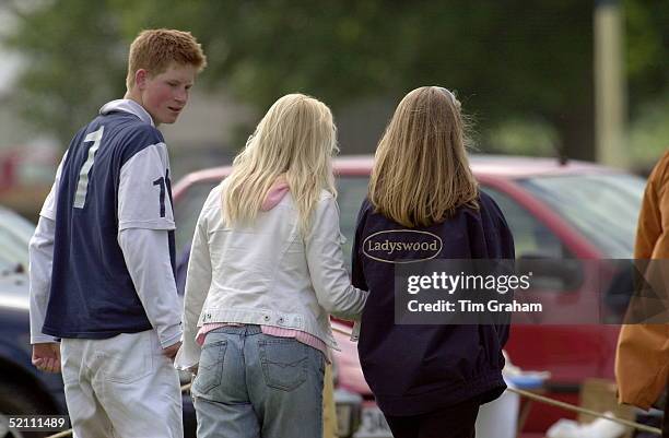 Prince Harry With Two Girls At The Beaufort Polo Club In Gloucestershire.