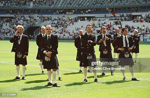 Scotland players including Scott Gemmil Jim Leighton Tommy Boyd Craig Burley and Barry Ferguson look on dressed in their Kilts before the opening...