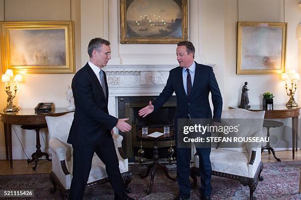 Britain's Prime Minister David Cameron and NATO Secretary General Jens Stoltenberg shake hands at the start of a meeting at 10 Downing Street in...