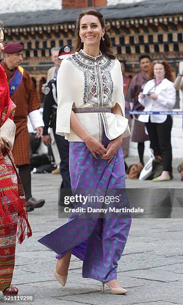 Catherine, Duchess of Cambridge walks with HM Jetsun Pema Wangchuck in front of monks in the Tashichhodzong on the first day of a two day visit to...