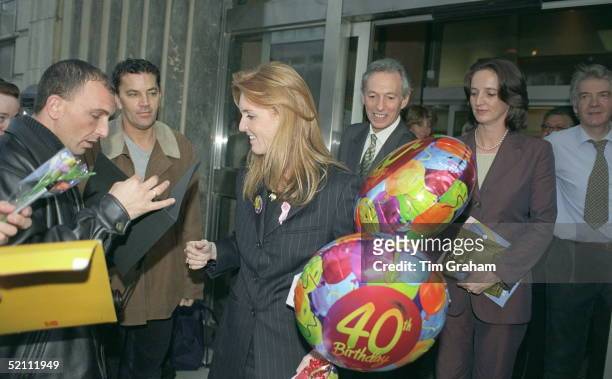 Sarah, The Duchess Of York Wearing A 40th Birthday Badge And Visiting The Teenage Cancer Trust At University College Hospital In London. Her Sister,...