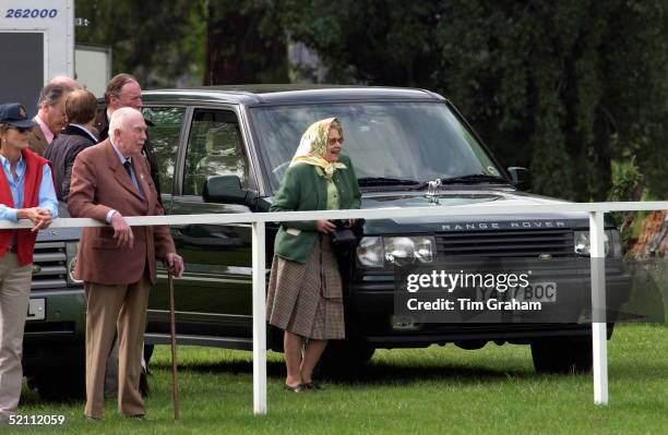 Queen Elizabeth II Relaxed And Laughing In Headscarf And Casual Clothes Watching Her Husband Prince Philip Taking Part In The International Driving...