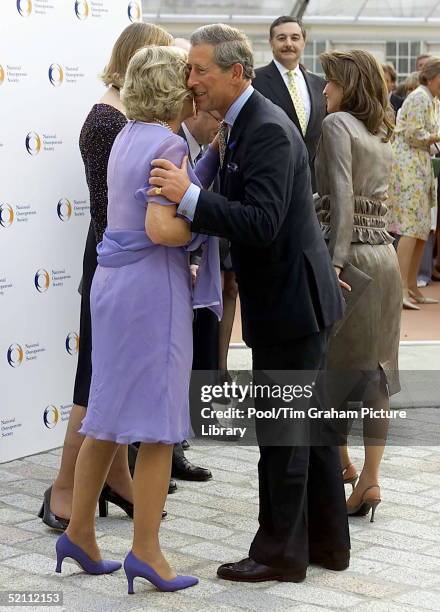 Camilla Parker-bowles In Her Official Role As Patron Of The National Osteoporosis Society Welcoming Prince Charles With A Kiss To The Anniversary...