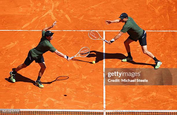 Bob Bryan of the United States and Mike Bryan of the United States in action during the round two doubles match against Juan Sebastian Cabal of...