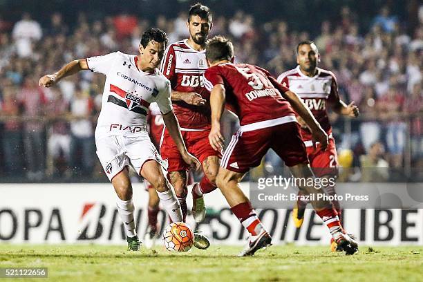 Paulo Henrique Ganso of Sao Paulo fights for the ball with Nicolas Domingo of River Plate during a match between Sao Paulo and River Plate as part of...