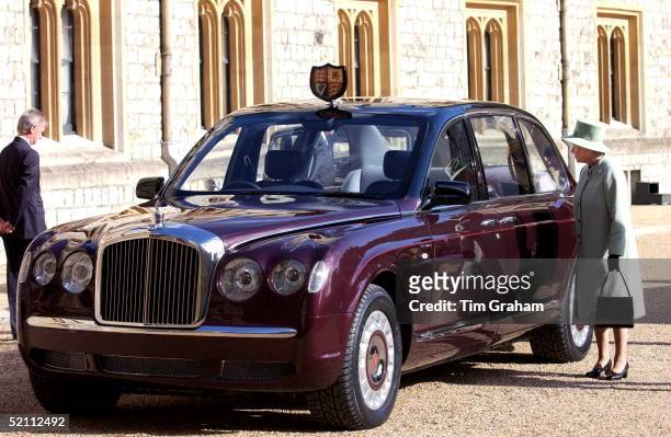 Queen Elizabeth II At Windsor Castle Inspecting The New Bentley State Limousine Car Presented To Her As A Golden Jubilee Gift On Behalf Of A...