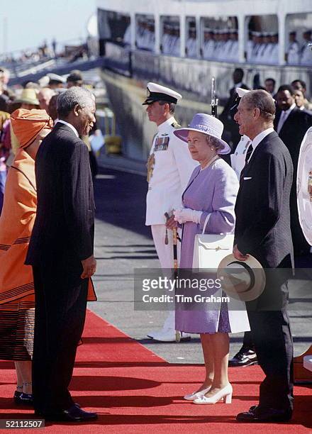The Queen And Prince Philip Disembark Hmy Britannia On Harrival In Cape Town, South Africa And Greet President Nelson Mandela.