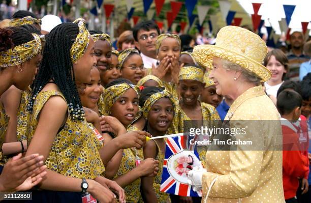 Queen Elizabeth Ll Visiting A Community Picnic Where Locals Are Providing Musical And Dance Entertainment To Celebrate The Ethnic Diversity Of West...