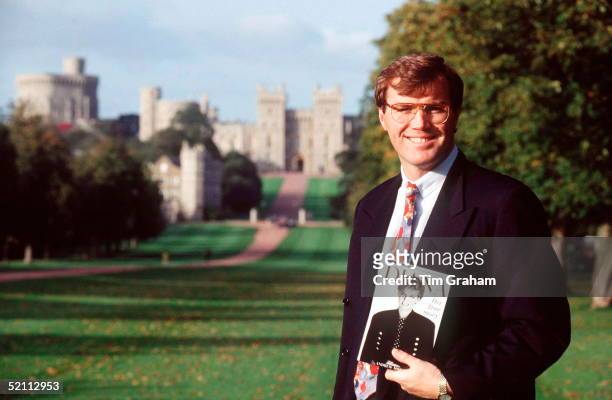 Author Andrew Morton In Front Of Windsor Castle Holding A Copy Of His Book On Diana