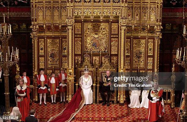 The Queen, With Prince Philip Sitting Beside Her, Preparing To Read Her Speech To The House Of Lords At The State Opening Of Parliament In London.to...